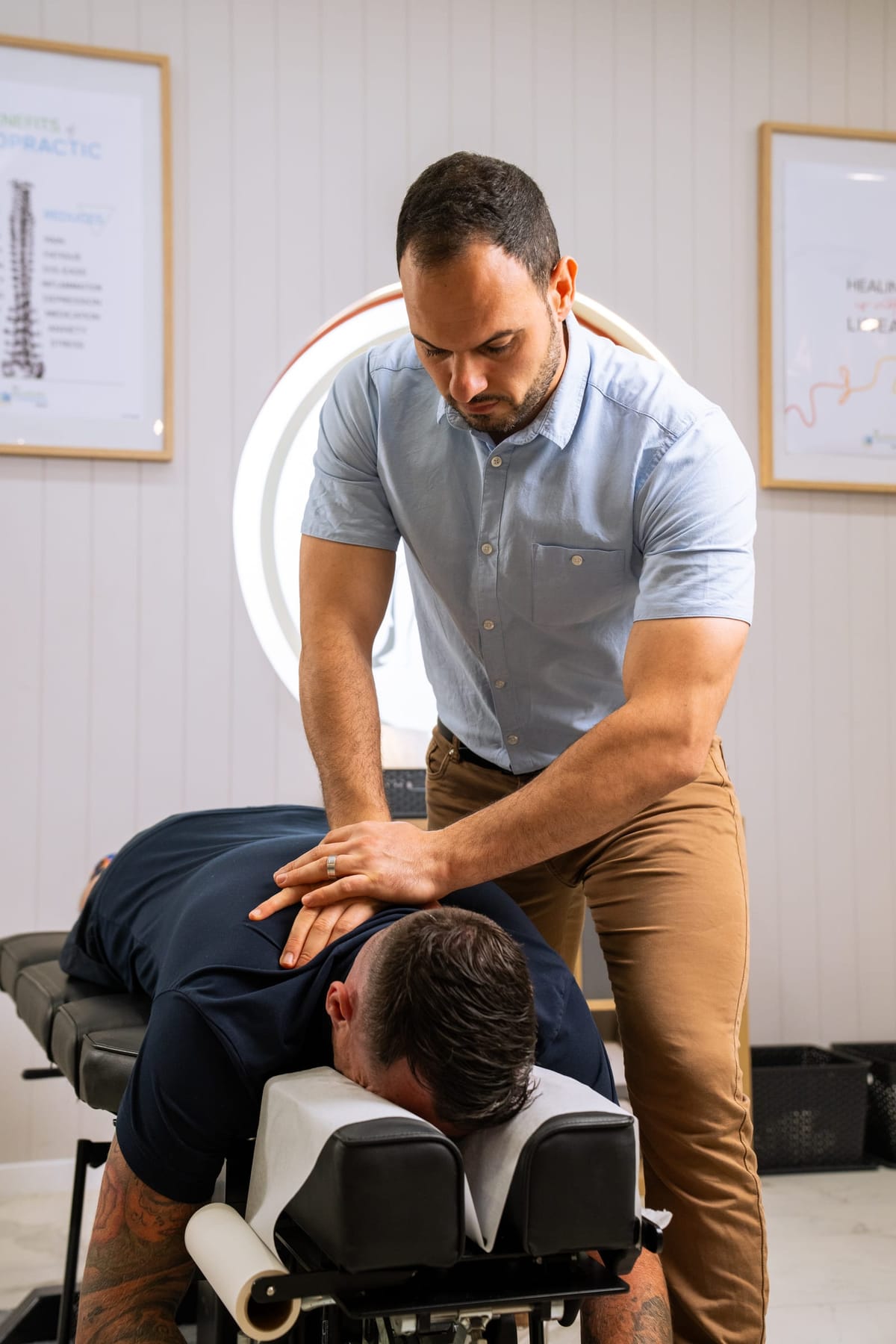 Dr Josh adjusting a patient’s mid back