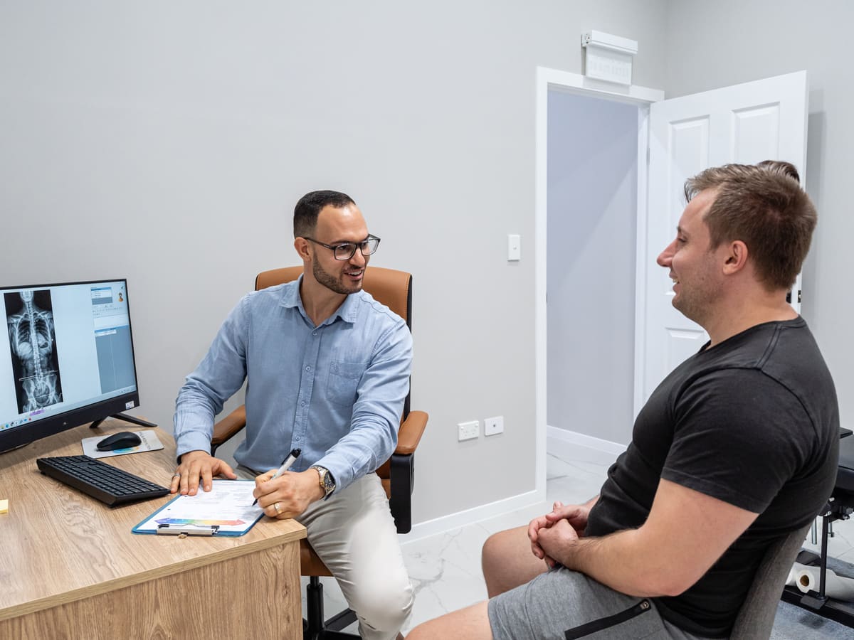Dr Josh chatting with a new patient during their consultation
