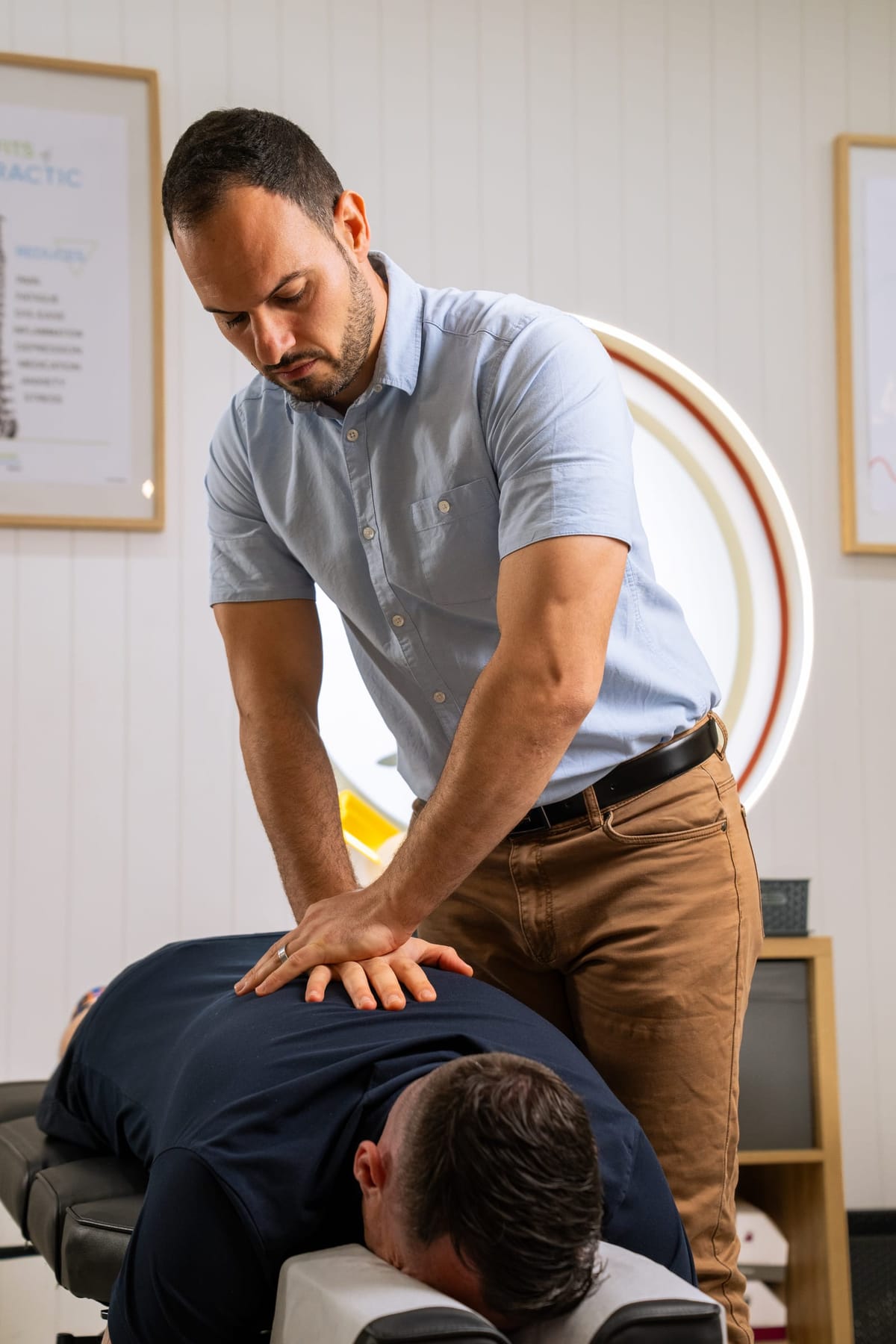 Dr Josh adjusting a patient during a wellness visit