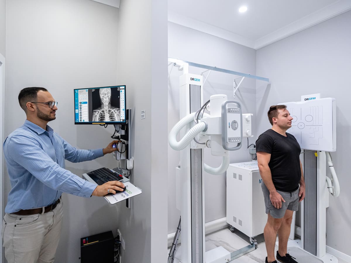 Dr Josh taking a spinal X-ray in the clinic’s in-house X-ray room